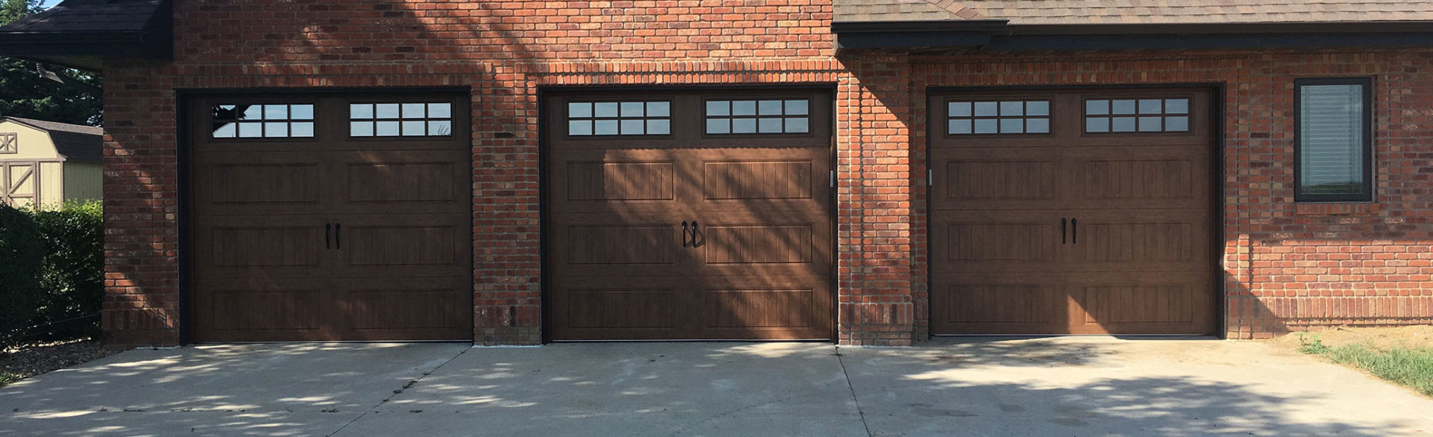 three residential carriage style garage doors installed in Nebraska