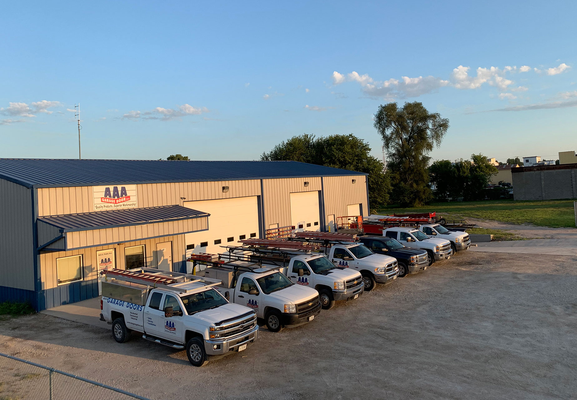 aaa garage door office with garage door service trucks lined up outside