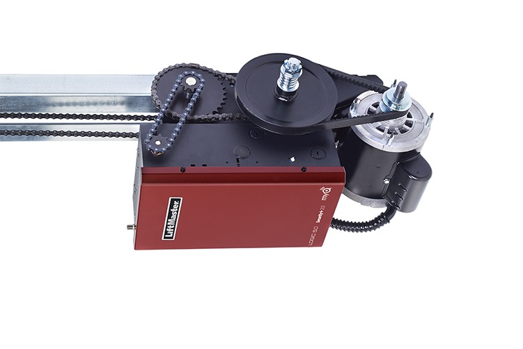 a red liftmaster garage door opener with a motor attached to it