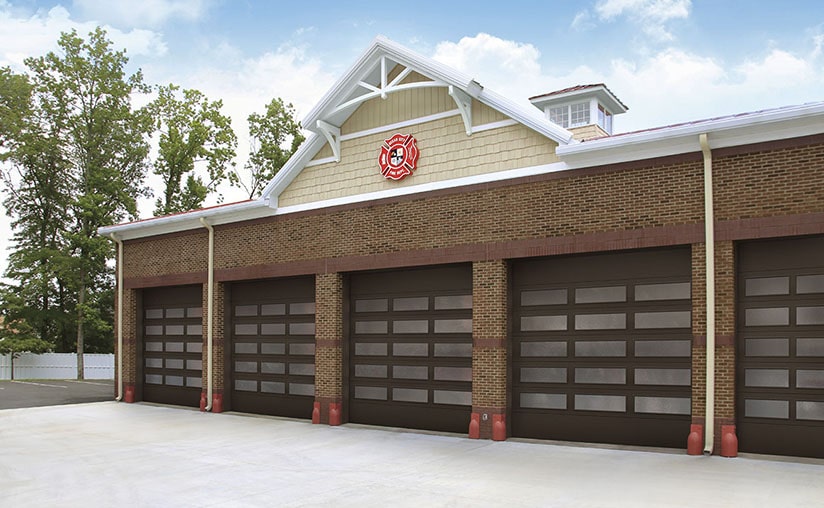 a firehouse with black garage doors