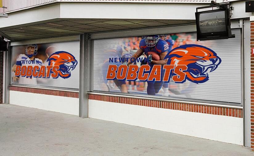a bobcats football team is displayed on a roll up door