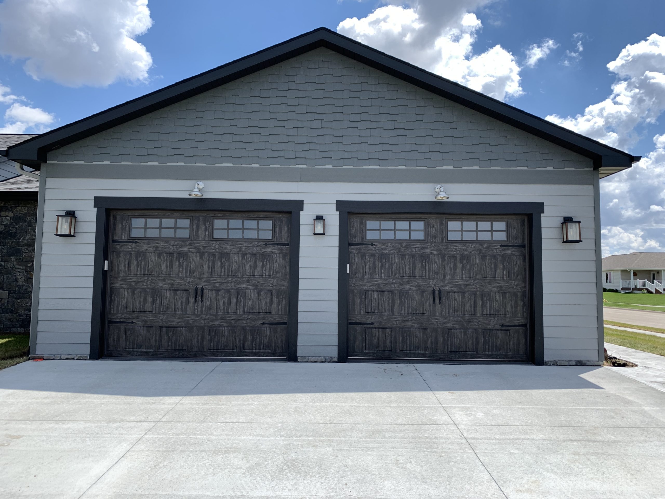 a close up image of a new carriage house garage door